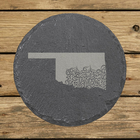 Oklahoma round slate coaster engraved with the state shape in ornate floral scrollwork