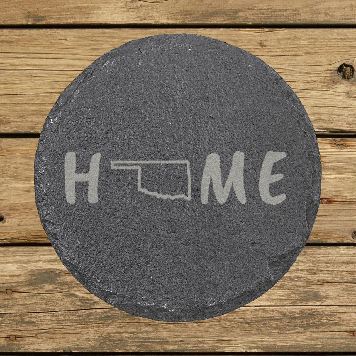 Oklahoma round slate coaster engraved with HOME using the state outline as the letter O