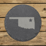 Oklahoma round slate coaster engraved with the state shape and a star