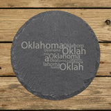 Oklahoma round slate coaster engraved with a word cloud of repeating Oklahoma text
