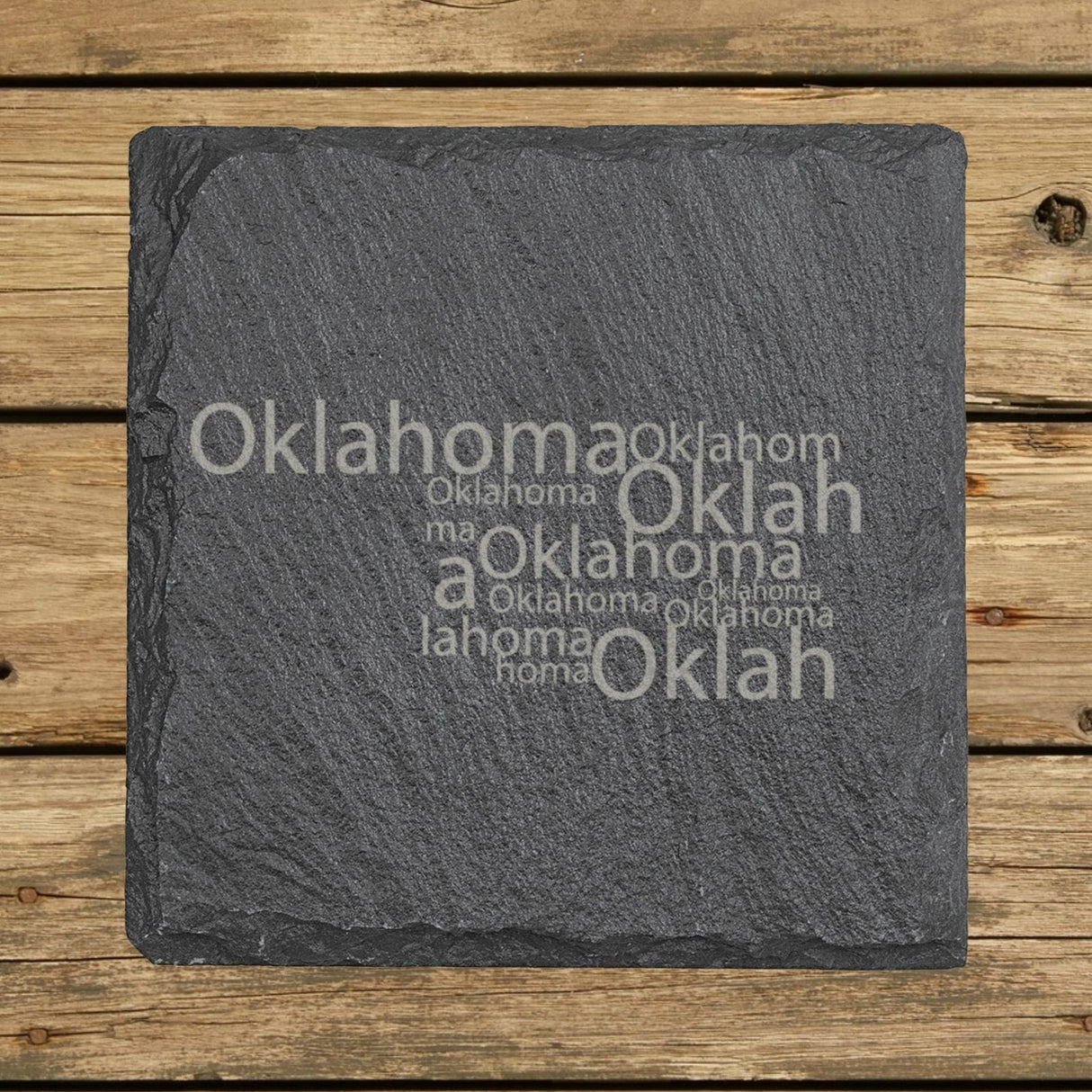 Oklahoma square slate coaster engraved with a word cloud of repeating Oklahoma text