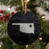 Oklahoma round slate Christmas ornament engraved with the state shape and a star