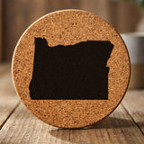 Oregon round cork coaster with the full state shape engraved