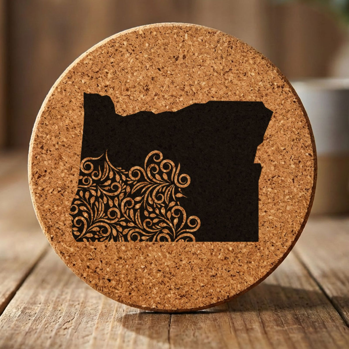 Oregon round cork coaster engraved with the state shape in ornate floral scrollwork