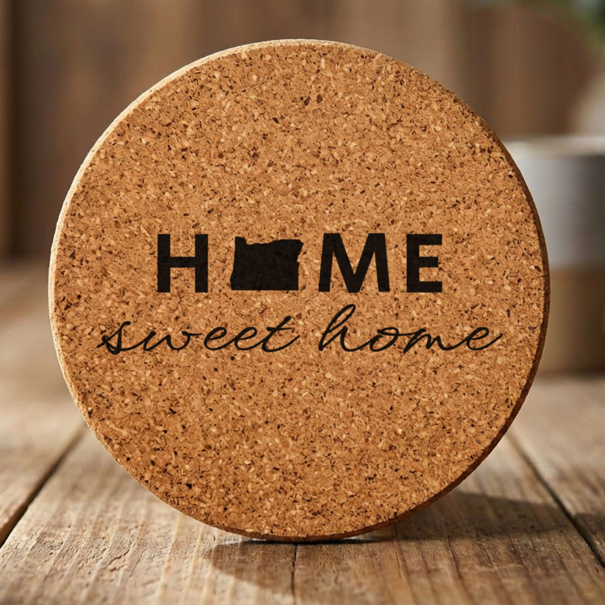 Oregon round cork coaster engraved with HOME sweet home using the state shape as the letter O