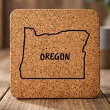 Oregon square cork coaster engraved with the state outline and OREGON in hand-drawn brush lettering