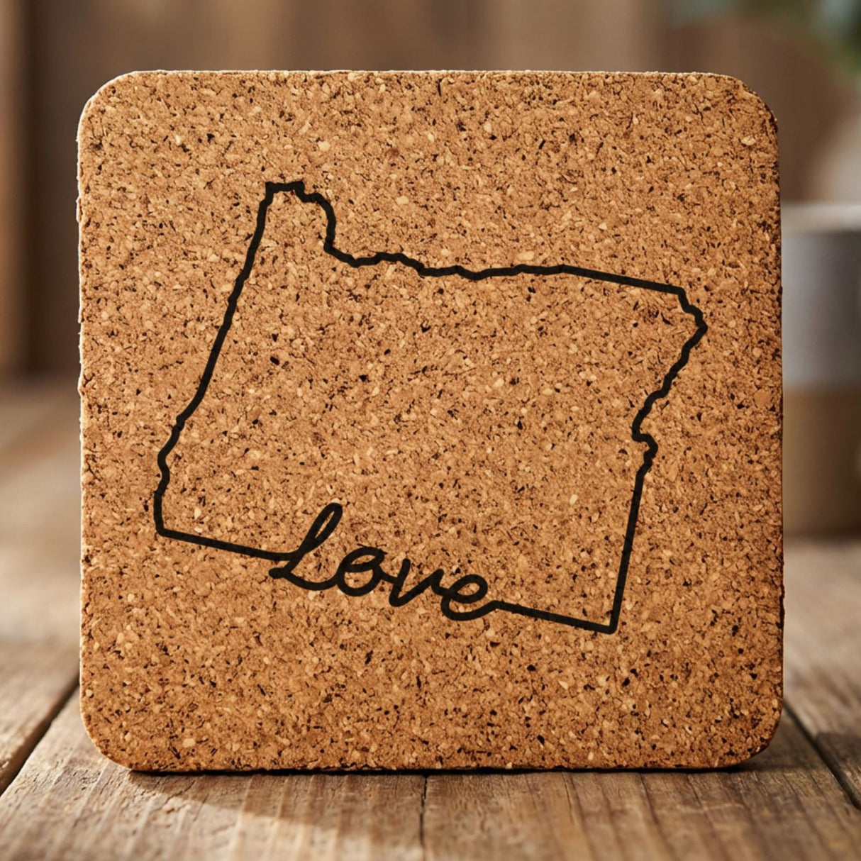 Oregon square cork coaster engraved with a hand-drawn state outline and love in cursive