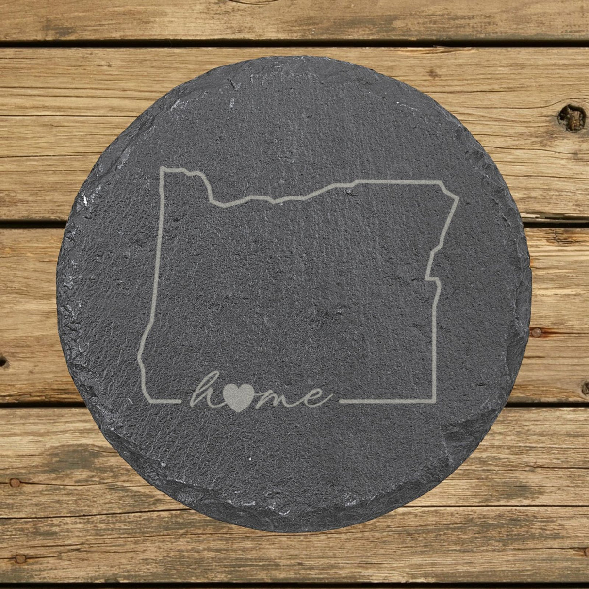 Oregon round slate coaster engraved with the state outline and home in script with a heart