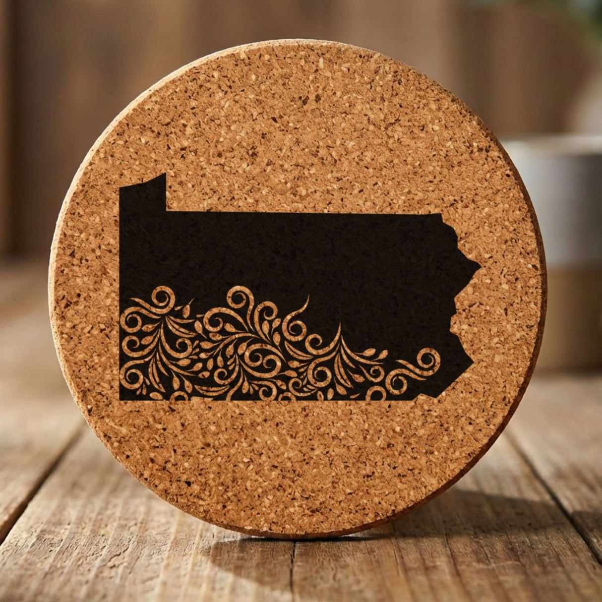 Pennsylvania round cork coaster engraved with the state shape in ornate floral scrollwork