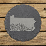 Pennsylvania round slate coaster engraved with the state shape in ornate floral scrollwork