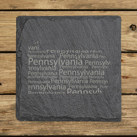 Pennsylvania square slate coaster engraved with a word cloud of repeating Pennsylvania text