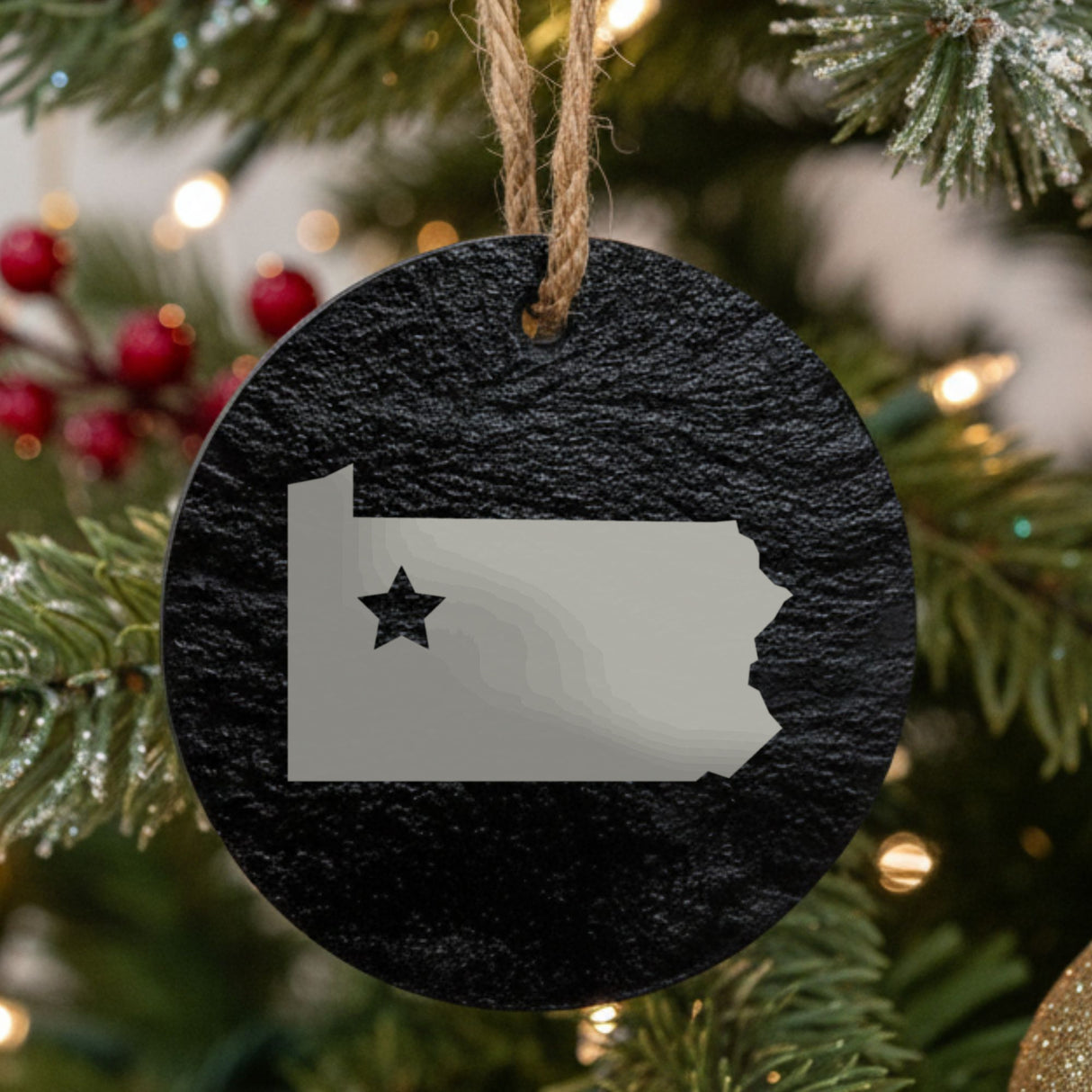 Pennsylvania round slate Christmas ornament engraved with the state shape and a star