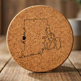 Rhode Island round cork coaster engraved with the state outline and home in script with a heart