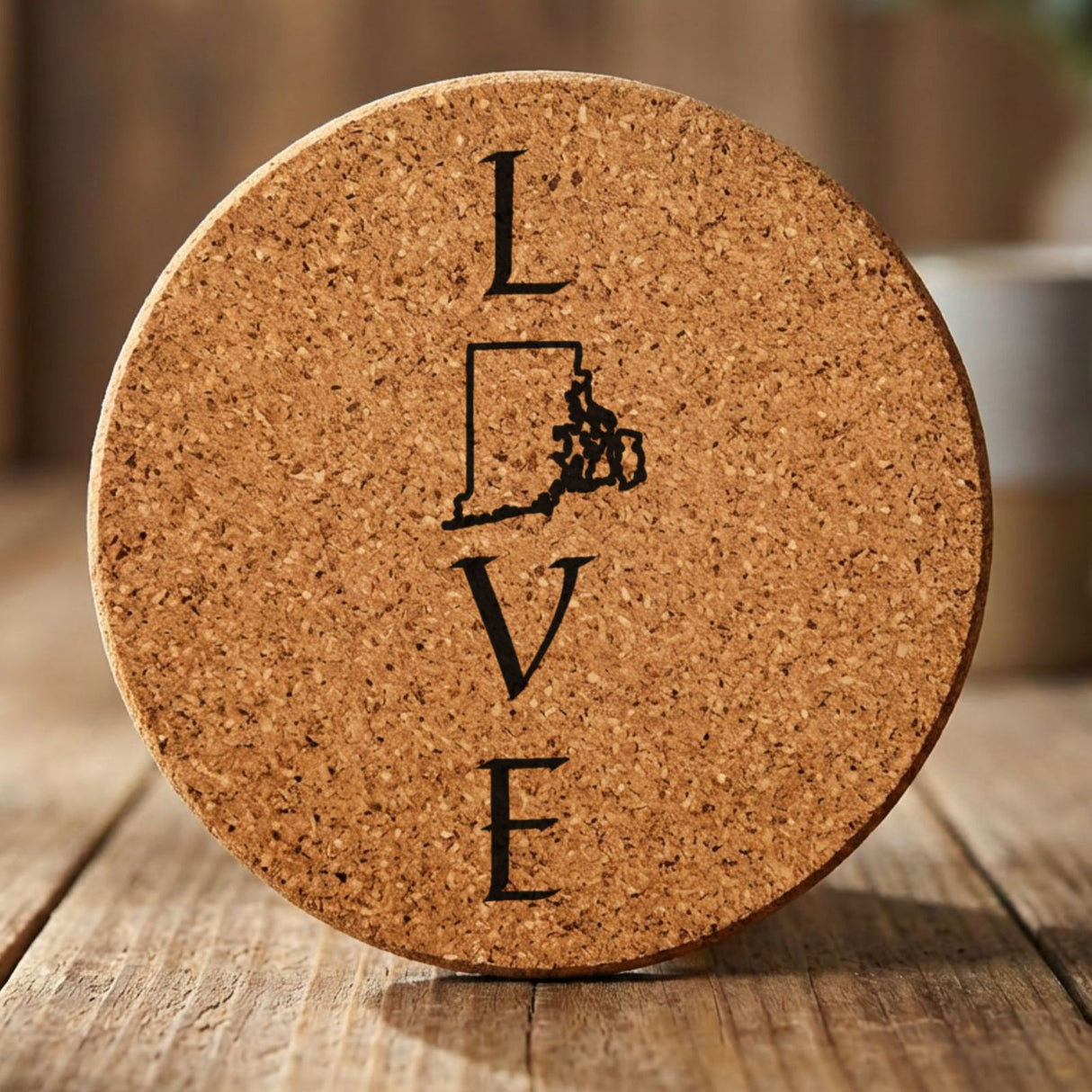 Rhode Island round cork coaster engraved with LOVE stacked vertically using the state as the letter O