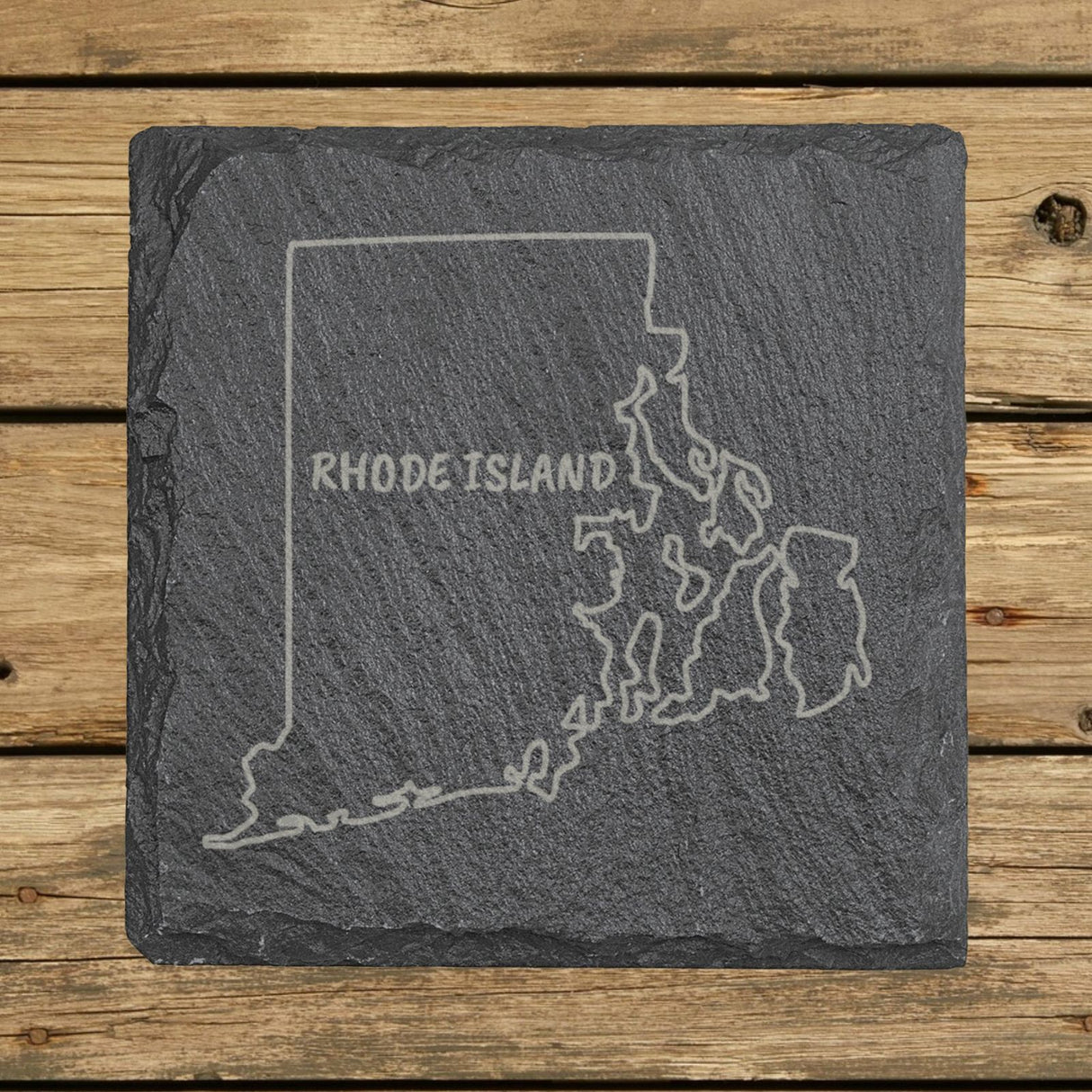 Rhode Island square slate coaster engraved with the state outline and RHODE ISLAND in hand-drawn brush lettering