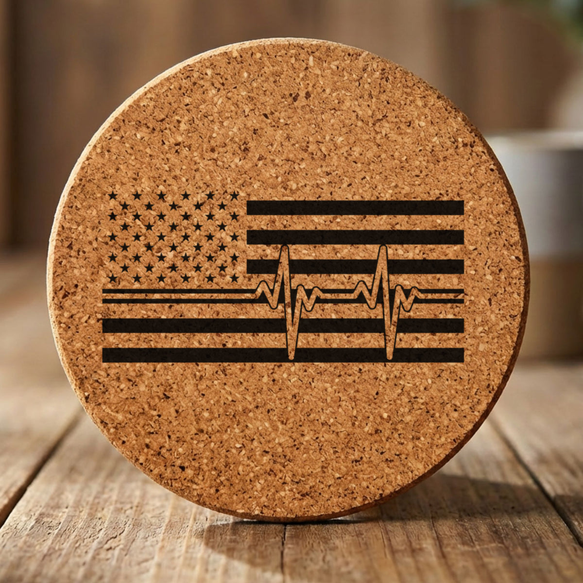 Round cork coaster laser engraved with an American flag, heartbeat design