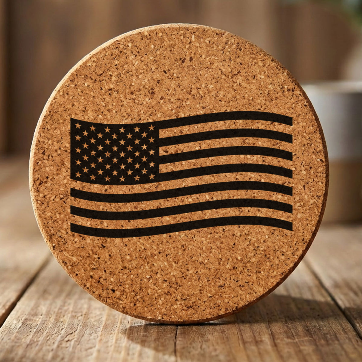 Round cork coaster laser engraved with an American flag, waving design