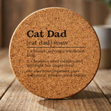 Round cork coaster laser engraved with the Cat Dad definition