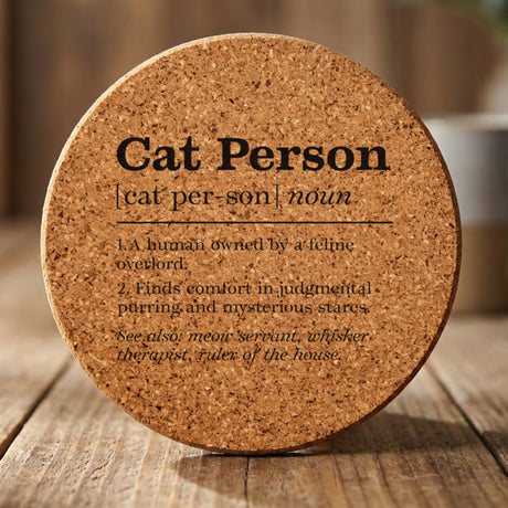 Round cork coaster laser engraved with the Cat Person definition