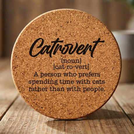 Round cork coaster laser engraved with the Catrovert definition