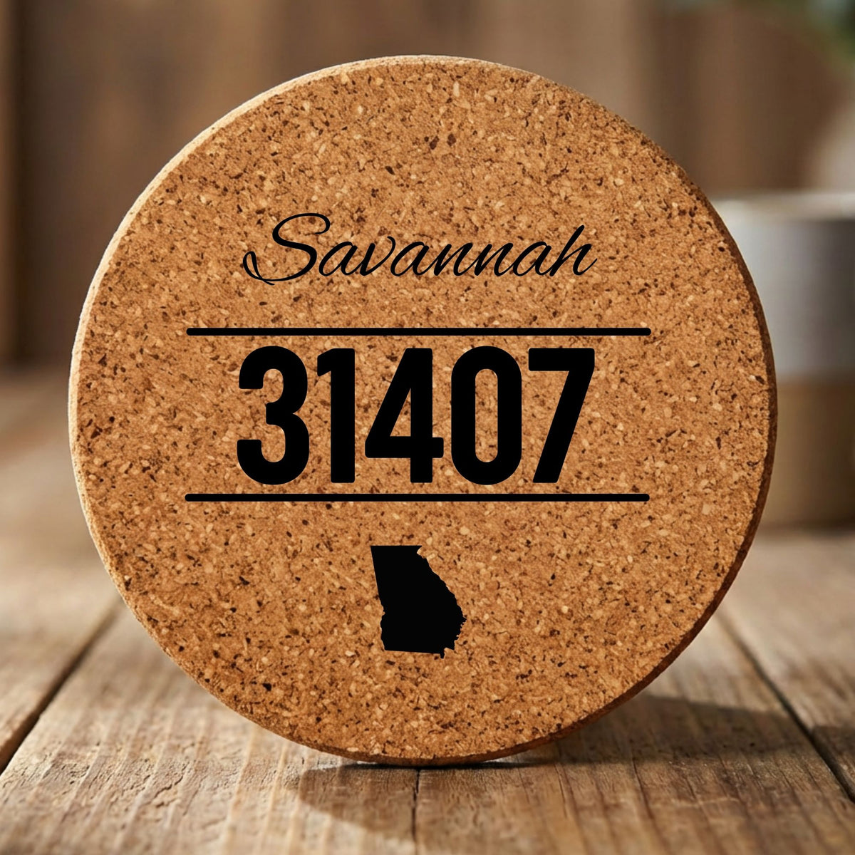 Round cork coaster laser engraved with a custom zip code design