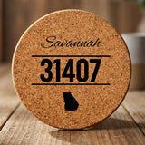 Round cork coaster laser engraved with a custom zip code design