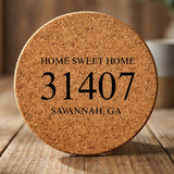 Round cork coaster laser engraved with a custom zip code design