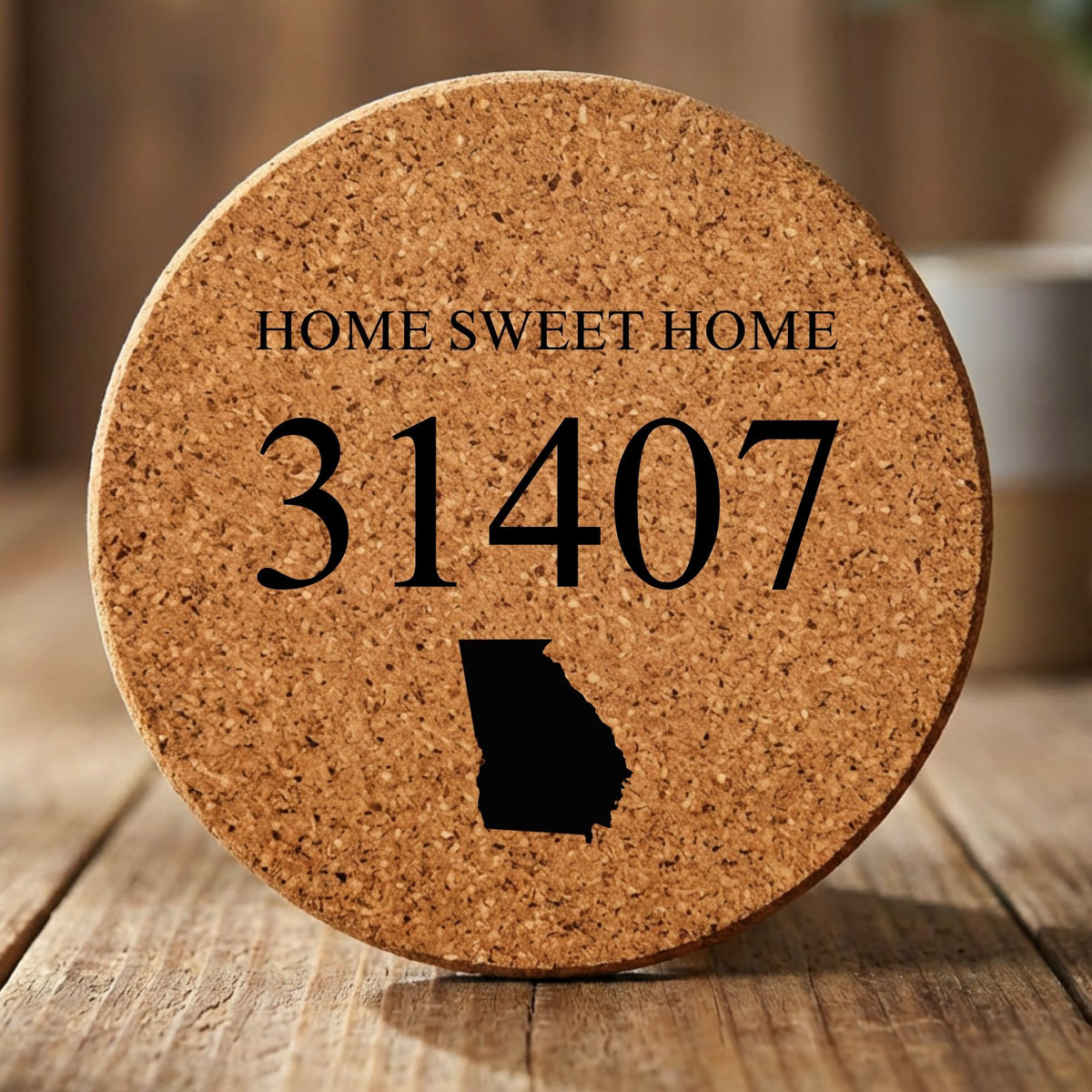 Round cork coaster laser engraved with a custom zip code design