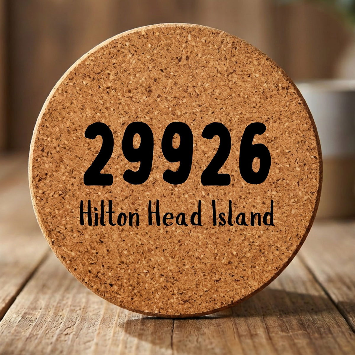 Round cork coaster laser engraved with a custom zip code design