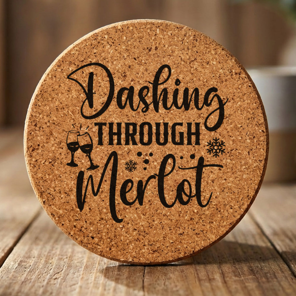 Round cork coaster laser engraved with "Dashing Through the Merlot"