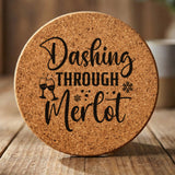 Round cork coaster laser engraved with "Dashing Through the Merlot"