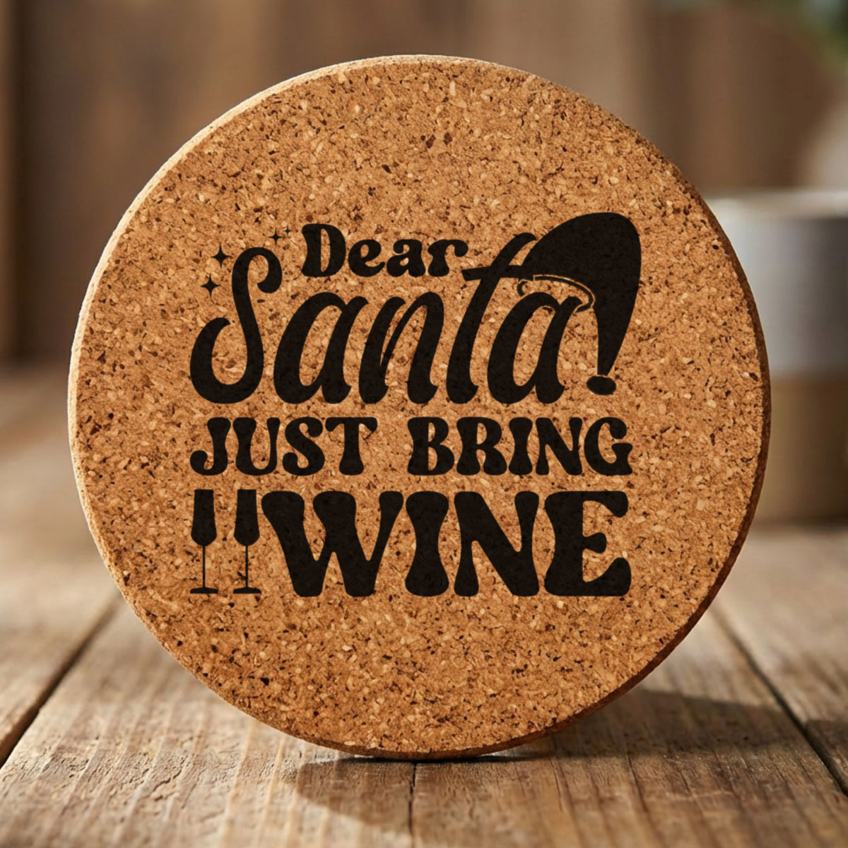 Round cork coaster laser engraved with "Dear Santa, Just Bring Wine", text design