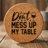 Round cork coaster laser engraved with "Don't Mess Up My Table", hand lettered design