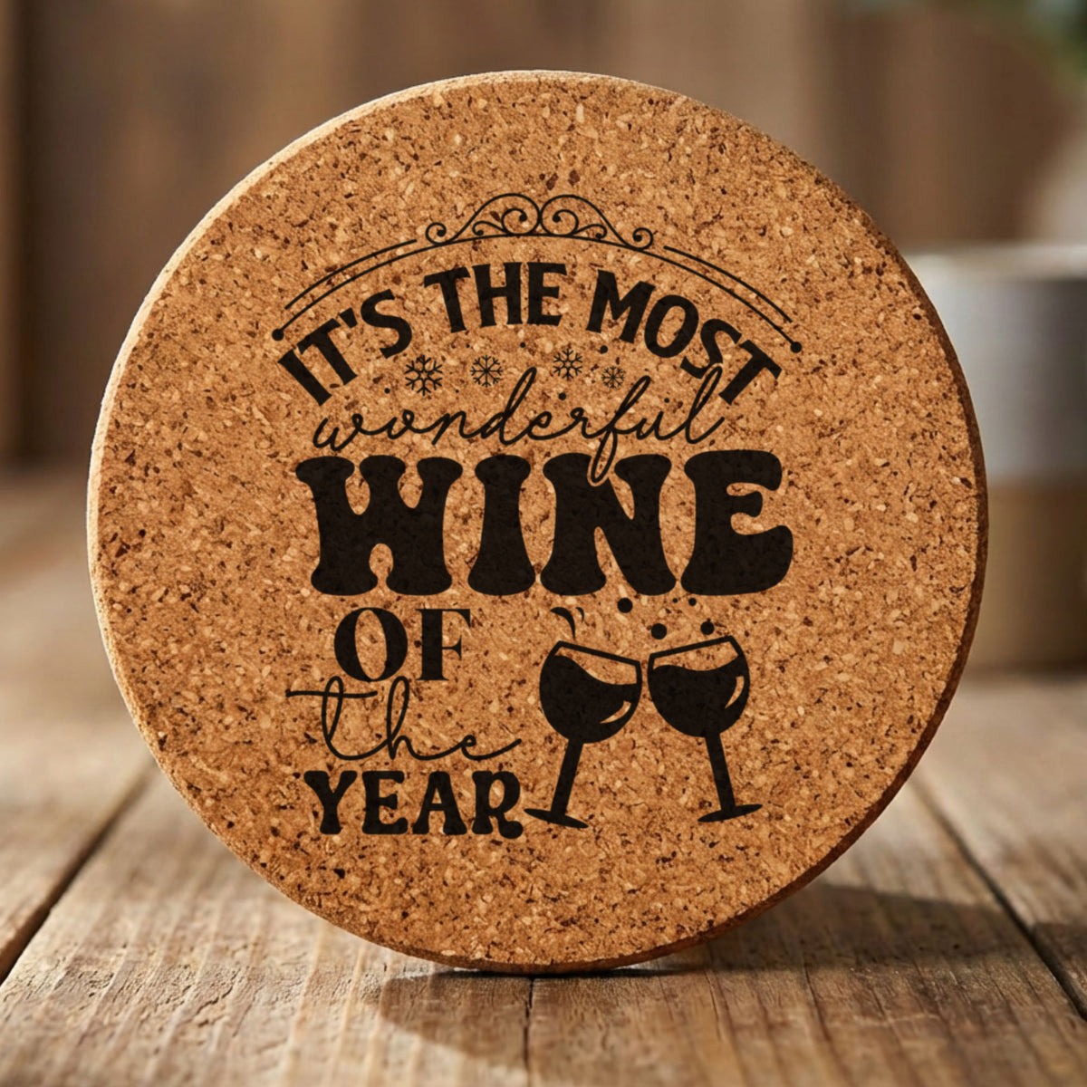 Round cork coaster laser engraved with "It's the Most Wonderful Wine of the Year"