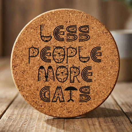 Round cork coaster laser engraved with "Less People, More Cats", retro design