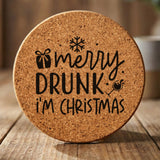 Round cork coaster laser engraved with "Merry Drunk I'm Christmas"