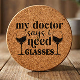Round cork coaster laser engraved with "My Doctor Says I Need Glasses"