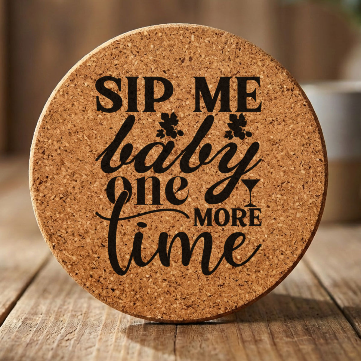 Round cork coaster laser engraved with "Sip Me Baby One More Time"