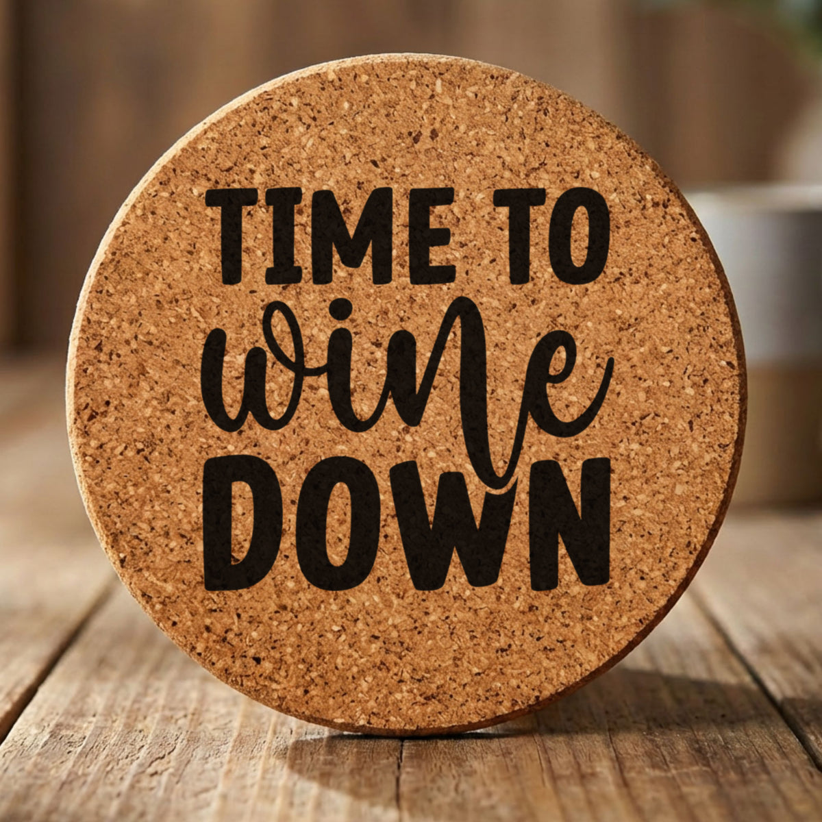 Round cork coaster laser engraved with "Time to Wine Down", classic design