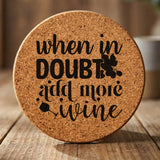 Round cork coaster laser engraved with "When in Doubt, Add More Wine", classic design