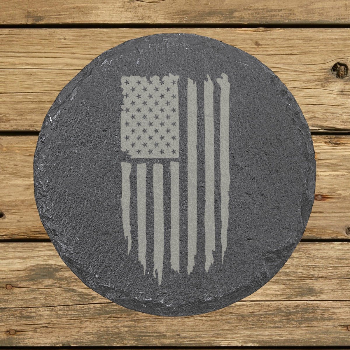 Round slate coaster laser engraved with an American flag, distressed vertical design