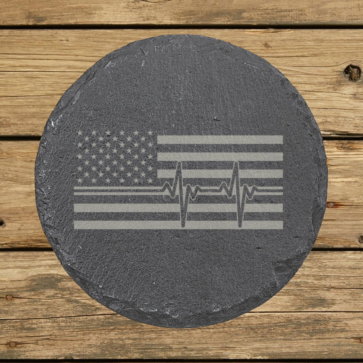 Round slate coaster laser engraved with an American flag, heartbeat design