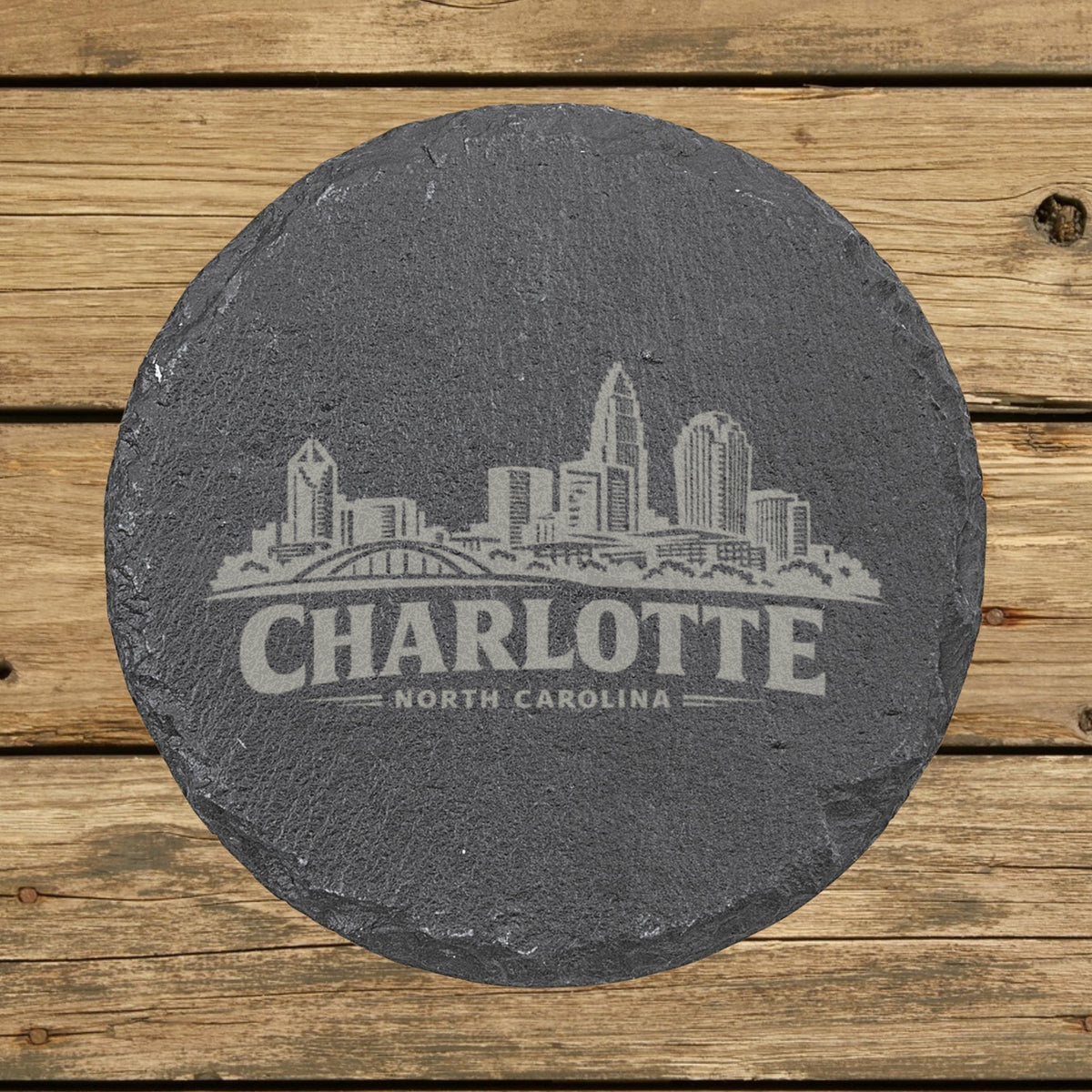 Round slate coaster laser engraved with the Charlotte, North Carolina skyline