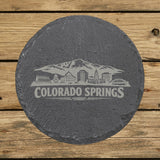 Round slate coaster laser engraved with the Colorado Springs, Colorado skyline