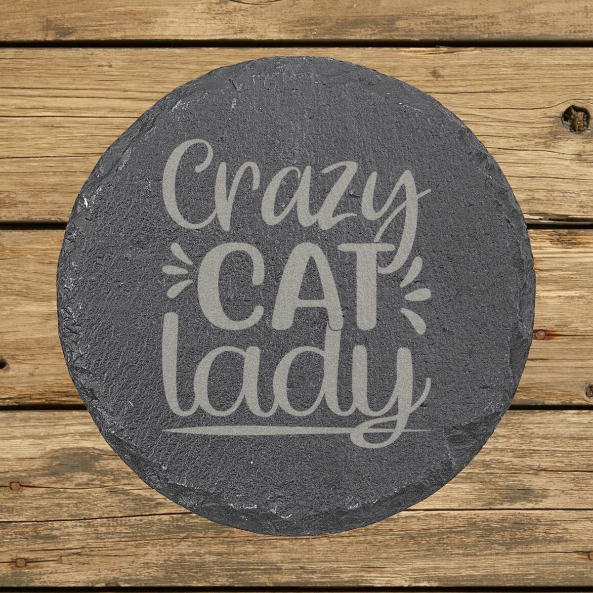 Round slate coaster laser engraved with "Crazy Cat Lady"