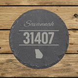 Round slate coaster laser engraved with a custom zip code design