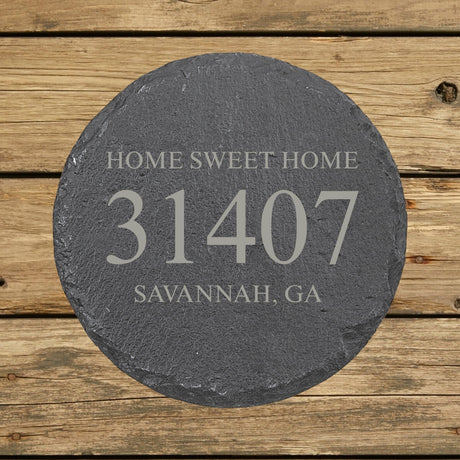 Round slate coaster laser engraved with a custom zip code design