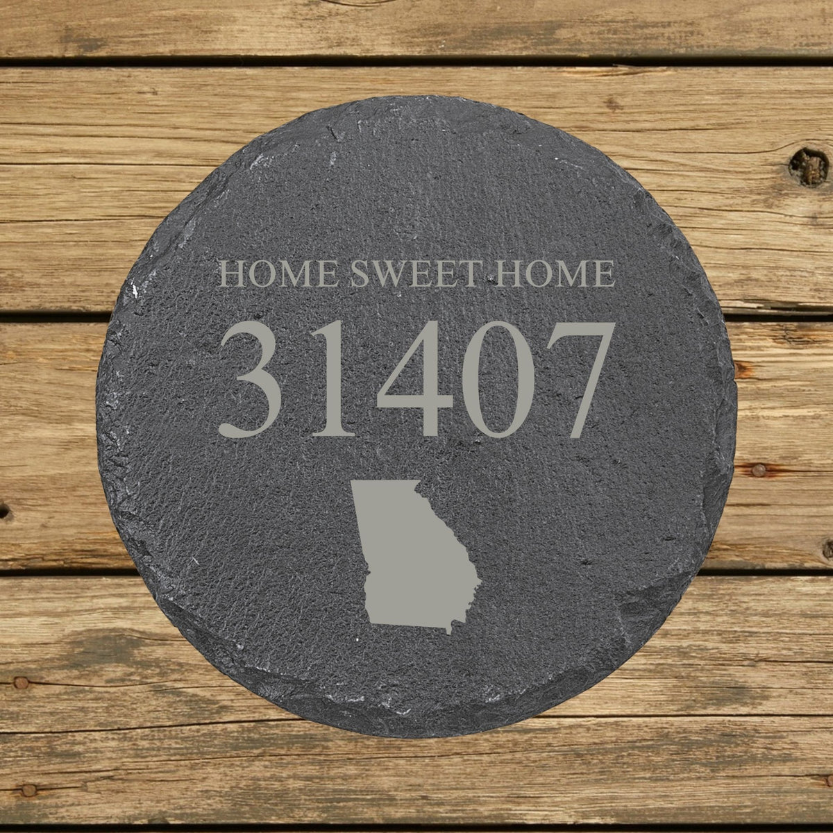Round slate coaster laser engraved with a custom zip code design