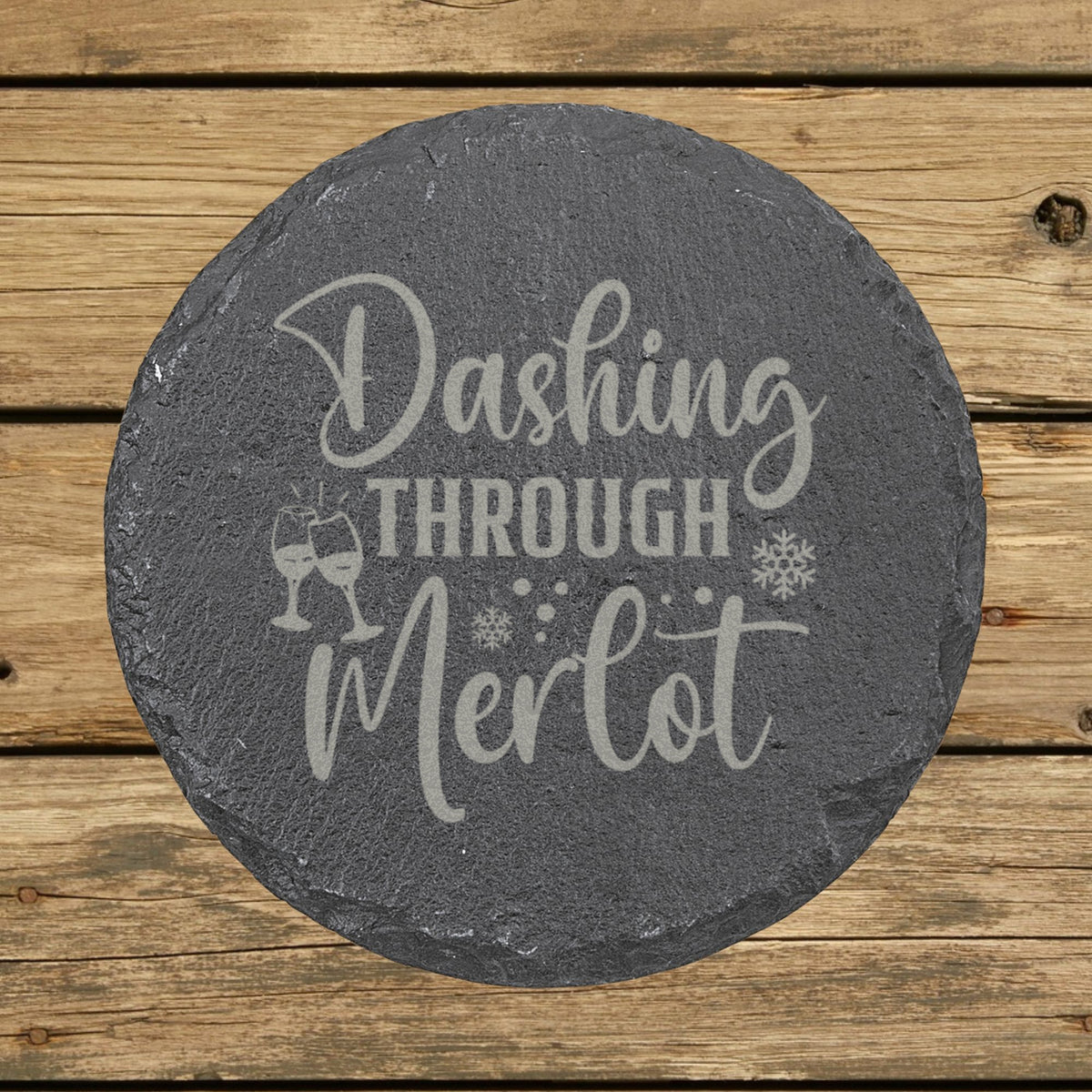 Round slate coaster laser engraved with "Dashing Through the Merlot"