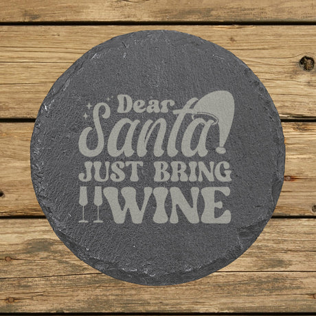 Round slate coaster laser engraved with "Dear Santa, Just Bring Wine", text design